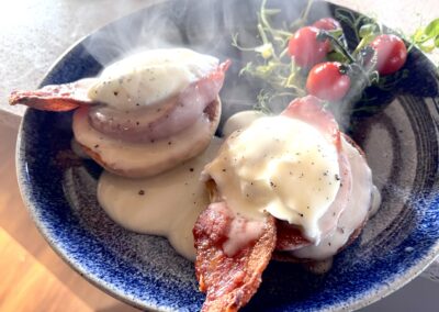 Eggs Benedict - Poached eggs, butchers bacon and Hollandaise Sauce.